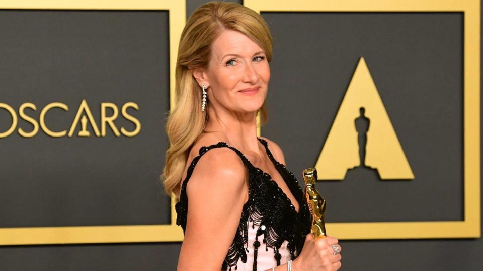 Laura Dern poses with her Oscar for Best Actress in a Supporting Role in 2020.