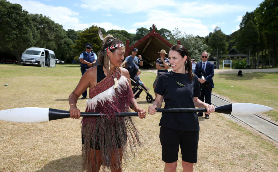 New Zealand Prime Minister Jacinda Ardern (R) learns how to paddle before she joins the the crew on the Te Whanau Moana waka built for women to paddle by Uncle Hector Busby on Feb. 5, 2020 in Waitangi, New Zealand.<span class="copyright">Fiona Goodall—Getty Images</span>