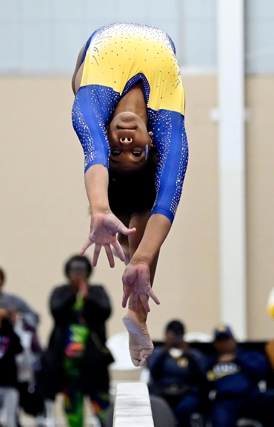 Fisk University gymnast Morgan Price competes on the balance beam during the Tennessee Collegiate Classic meet Friday, Jan. 20, 2023, in Lebanon, Tenn. Fisk is the first historically Black university to have an intercollegiate women’s gymnastics team.