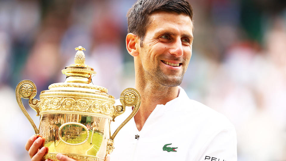 Novak Djokovic, pictured here celebrating with the trophy after winning his sixth Wimbledon title.