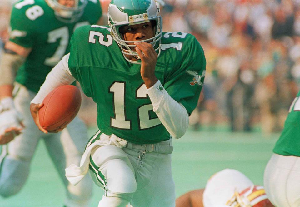 Philadelphia Eagles quarterback Randall Cunningham runs with the ball against the Washington Redskins in Philadelphia on Nov. 9, 1987.
