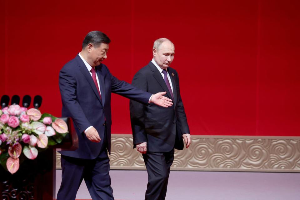 Vladimir Putin and Xi Jinping attend the gala celebration of 75 years of diplomatic relations (Reuters)