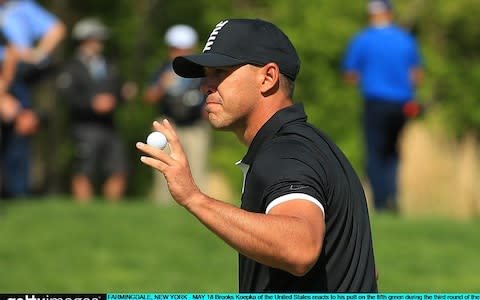 Brooks Koepka of the United States reacts to his putt on the fifth green - Credit: Getty Images