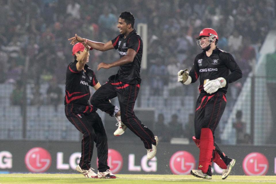 Hong Kong's bowler Nadeem Ahmed jumps in air as he celebrates a Bangladeshi wicket during their ICC Twenty20 Cricket World Cup match in Chittagong, Bangladesh, Thursday, March 20, 2014. (AP Photo/Bikas Das)