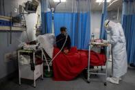 Medical workers treat patients infected with the coronavirus disease (COVID-19) at a hospital in New Delhi