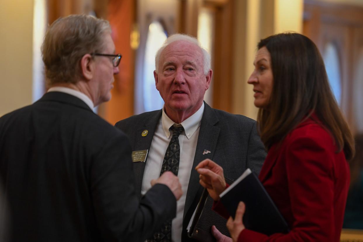 State representative Mike Derby talks with other legislators after the annual budget address on Tuesday, Dec. 5, 2023 at the South Dakota State Capitol in Pierre.