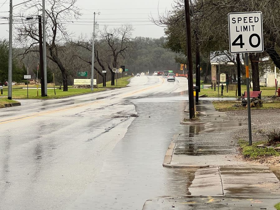 Water on Highway 77 through downtown La Grange in Fayette County after heavy rainfall on Jan. 24, 2023. (KXAN Photo/Todd Bailey)