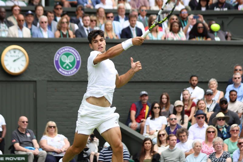 Spain's Carlos Alcaraz (pictured) totaled 16 aces in a five-set win over American Frances Tiafoe on Friday at Wimbledon. Photo by Hugo Philpott/UPI