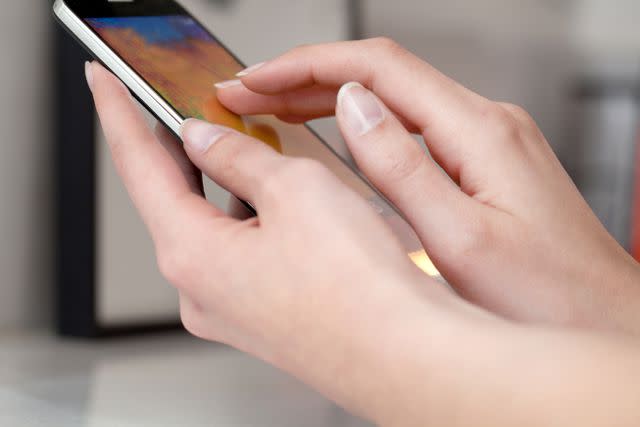 Daniel Allen/Cultura/Getty Images Stock image of someone touching on their phone screen