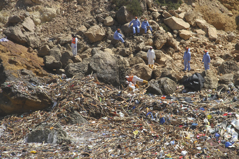 Rescue teams look for flash flood victims in the city of Derna, Libya, Monday, Sept. 18, 2023. Mediterranean storm Daniel caused flooding that overwhelmed two dams, sending a wall of water through the city. More than 10,000 were killed, and another 10,000 are missing. (AP Photo/Yousef Murad)