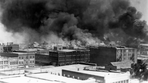 PHOTO: Black smoke billows from fires during the Tulsa Race Massacre of 1921, in the Greenwood District, Tulsa, Okla., June 1921. (Historical/Corbis via Getty Images, FILE)