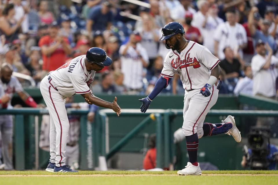 Atlanta Braves' Michael Harris II, right, rounds the bases past third base coach Ron Washington after hitting a two-run home run in the fifth inning of a baseball game against the Washington Nationals, Thursday, July 14, 2022, in Washington. (AP Photo/Patrick Semansky)