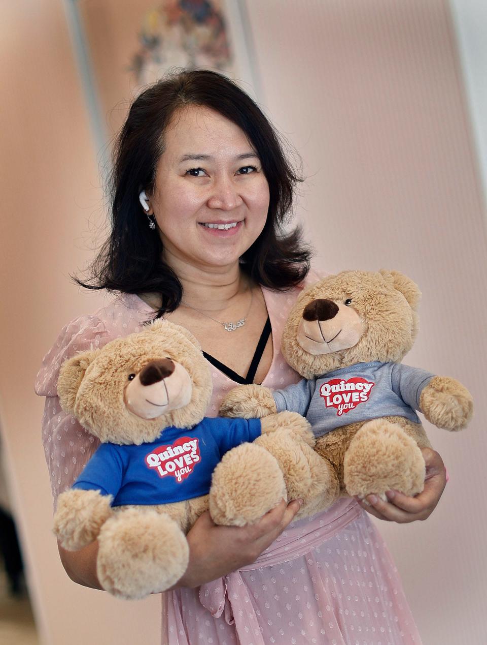 Thuy Leung of Quincy came to the United States as a child refugee from Vietnam. She has created a 'Quincy Loves You' bear for refugee children passing through the temporary shelter at Eastern Nazarene College.