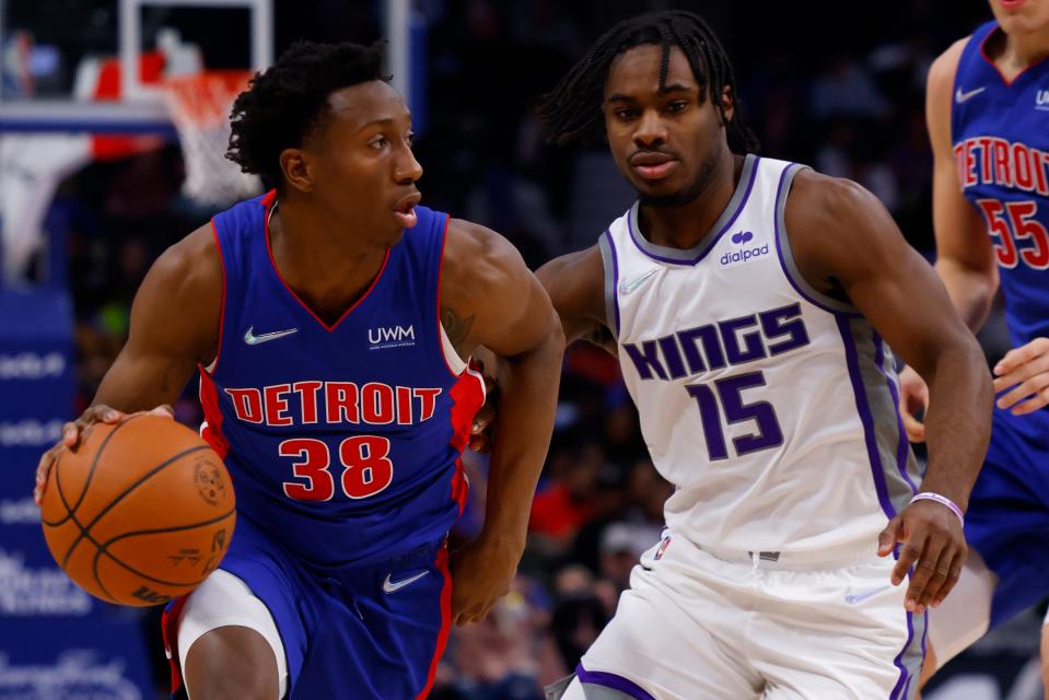 Pistons guard Saben Lee dribbles defended by Kings guard Davion Mitchell in the second half of the Pistons' 129-107 loss on Monday, Nov. 15, 2021, at Little Caesars Arena.