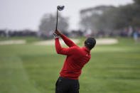 Tiger Woods hits his tee shot on the fourth hole of the South Course at Torrey Pines Golf Course during the final round of the Farmers Insurance golf tournament Sunday Jan. 26, 2020, in San Diego. (AP Photo/Denis Poroy)