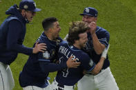 Tampa Bay Rays' Brett Phillips (14) celebrates after getting the game winning hit against the Los Angeles Dodgers in Game 4 of the baseball World Series Saturday, Oct. 24, 2020, in Arlington, Texas. Rays defeated the Dodgers 8-7 to tie the series 2-2 games. (AP Photo/Sue Ogrocki)