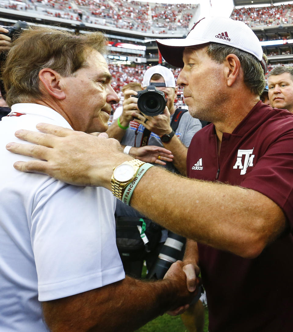 Alabama head coach Nick Saban shakes hands with Texas A&M head coach Jimbo Fisher after the end of an NCAA college football game, Saturday, Sept. 22, 2018, in Tuscaloosa, Ala. (AP Photo/Butch Dill)