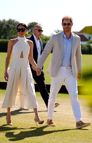 <p>Rebecca Blackwell/AP</p> Meghan Markle (left) and Prince Harry attend the Royal Salute Polo Challenge in Florida on April 12, 2024