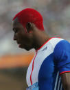 ATHENS - AUGUST 20: Phillips Idowu of Great Britain competes in the men's triple jump qualifying round on August 20, 2004 during the Athens 2004 Summer Olympic Games at the Olympic Stadium in the Sports Complex in Athens, Greece. (Photo by Stu Forster/Getty Images)