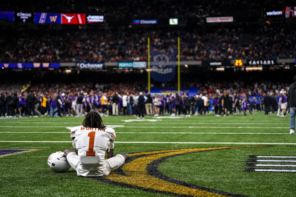 Texas wide receiver Xavier Worthy sits in the end zone after the Longhorns' 37-31 loss to Washington in the College Football Playoff semifinals in the Sugar Bowl. He along with fellow top receiving threats Adonai Mitchell, Jordan Whittington and Ja'Tavion Sanders have all moved on to the NFL.