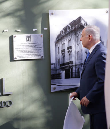 Israeli Prime Minister Benjamin Netanyahu pays homage to the victims of the 1992 embassy bombing during a ceremony in front of the outline of the former Israeli embassy in Buenos Aires, Argentina September 11, 2017. Embassy of Israel in Buenos Aires/Handout via REUTERS