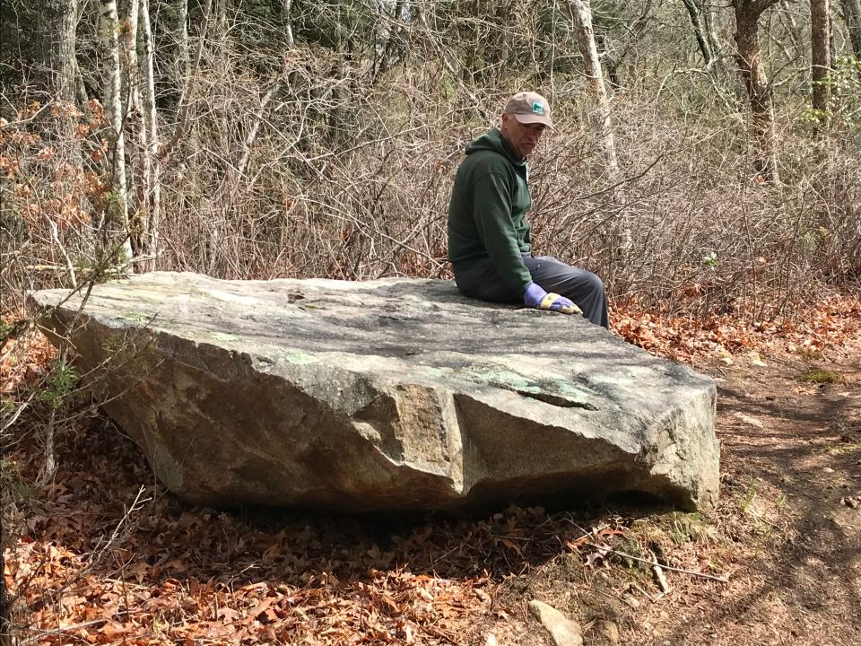 A flat rock just off the trail is a good spot for hikers to take a break.