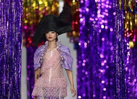 A model presents a creation at the Ryan Lo catwalk show during London Fashion Week Spring/Summer 2017 in London, Britain September 16, 2016. REUTERS/Neil Hall