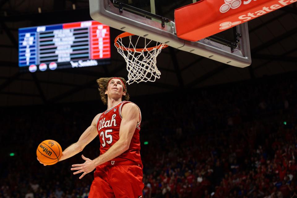 Utah Utes center Branden Carlson (35) dunks the ball in the final minute of a men’s basketball game against the Brigham Young Cougars at the Jon M. Huntsman Center in Salt Lake City on Saturday, Dec. 9, 2023.