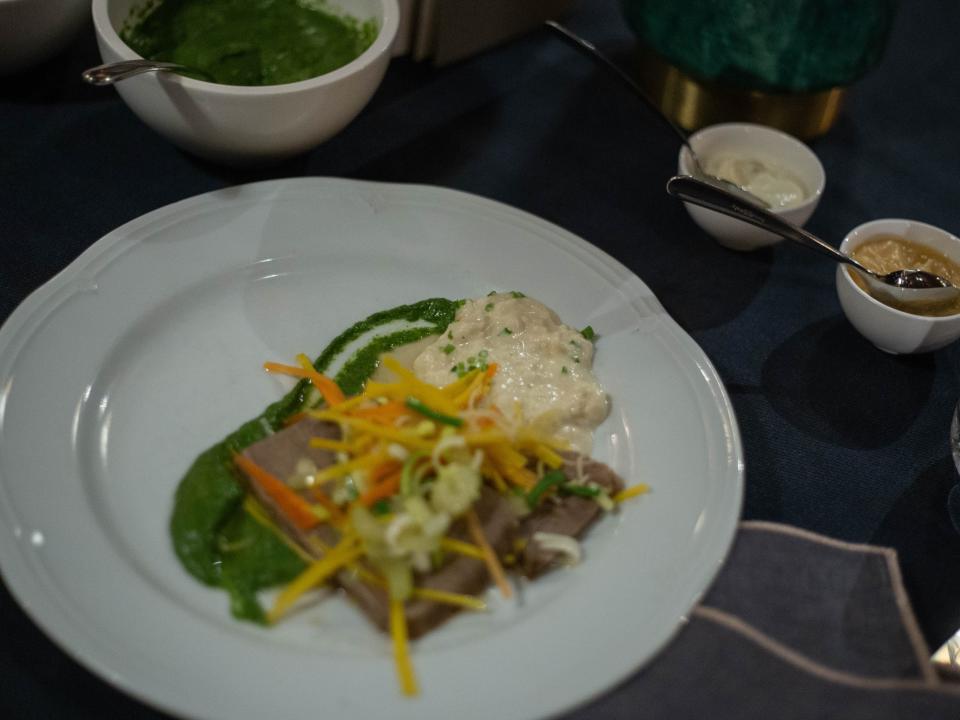 A white plate with Tafelspitz, beef that is cut from the rump of the cow.