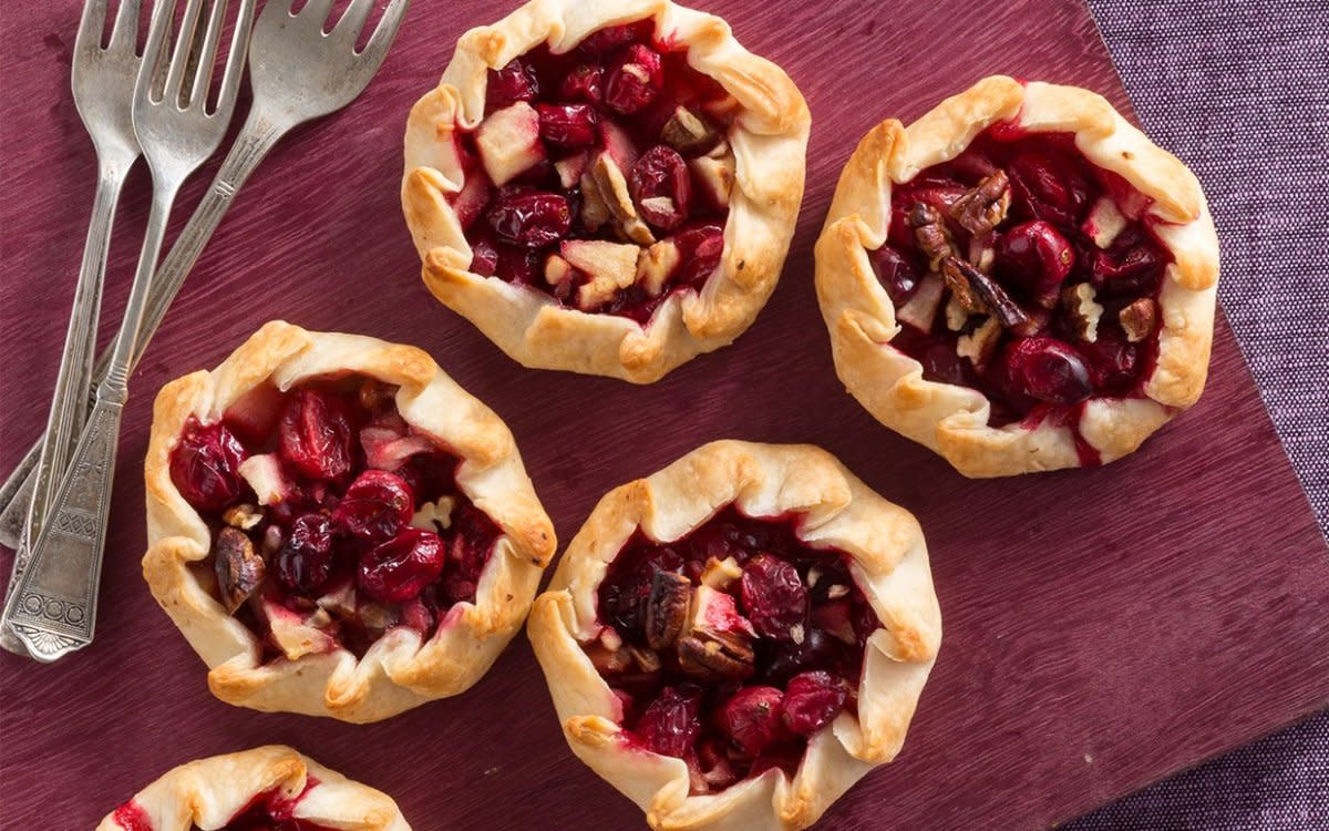 <p>Tonya Whitaker</p><p>These mini cranberry apple pies are perfect for Thanksgiving potluck!</p><p><strong>Get the recipe: <a href="https://parade.com/842496/communitytable/mini-cranberry-apple-pies/" rel="nofollow noopener" target="_blank" data-ylk="slk:Mini Cranberry Apple Pies;elm:context_link;itc:0;sec:content-canvas" class="link rapid-noclick-resp">Mini Cranberry Apple Pies</a></strong></p>