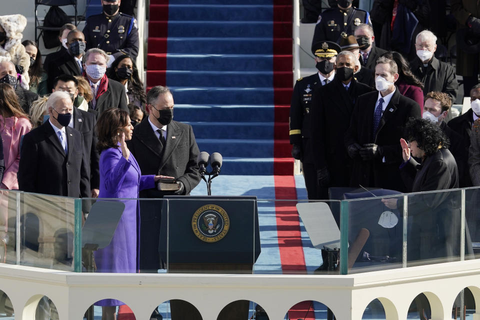 Kamala Harris is sworn in as vice president by Supreme Court Justice Sonia Sotomayor as her husband Doug Emhoff holds the Bible during the 59th Presidential Inauguration at the U.S. Capitol in Washington, Wednesday, Jan. 20, 2021. (AP Photo/Patrick Semansky, Pool)