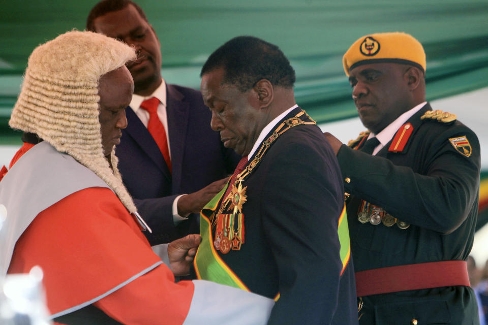 Zimbabwean President Emmerson Mnangagwa during his inauguration ceremony at the National Sports Stadium in Harare, Sunday, Aug. 26, 2018. The Constitutional Court upheld Mnangagwa's narrow election win Friday, saying the opposition did not provide " sufficient and credible evidence" to back vote- rigging claims.(AP Photo/Tsvangirayi Mukwazhi)