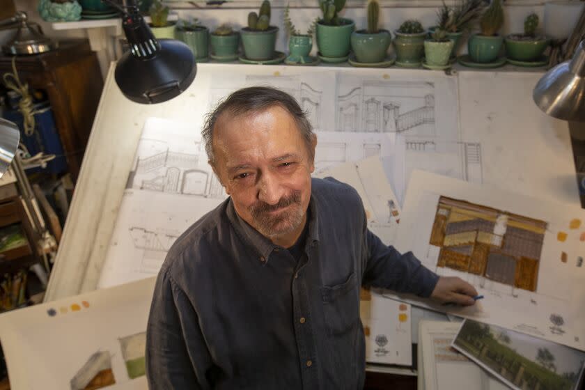 ATWATER VILLAGE, CALIF. -- FRIDAY, JANUARY 3, 2020: John Iacovelli, scenic designer, shown with his set drawings for "Arsenic and Old Lace" at his home studio, which premiers at La Mirada at end of January. Photo taken at his home studio in Atwater Village, Calif., on Jan. 3, 2020. (Allen J. Schaben / Los Angeles Times)