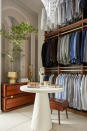 <p> Always look at interior designers for small walk-in closet ideas. This space designed by Maestri Studio shows how you can utlize the height of your closet when the width is too tight. Three hanging rails on top of each give oodles of clothing space, you can reach them via a custom ladder or hook. Use a side table for jewellery and invest in a slimline dresser for folded pieces.  </p>