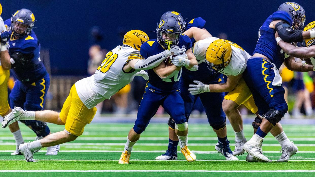 Northern Arizona sophomore running back Draycen Hall (26) rushes through the Idaho defense on Sept. 24, 2022.