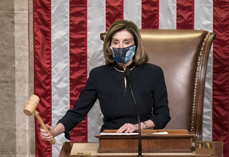 Speaker of the House Nancy Pelosi, D-Calif., leads the final vote of the impeachment of President Donald Trump for his role in inciting an angry mob to storm the Congress last week, at the Capitol in Washington, Wednesday, Jan. 13, 2021. (AP Photo/J. Scott Applewhite)