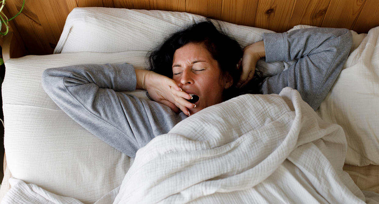 Woman yawning tired after bad night's sleep. (Getty Images)