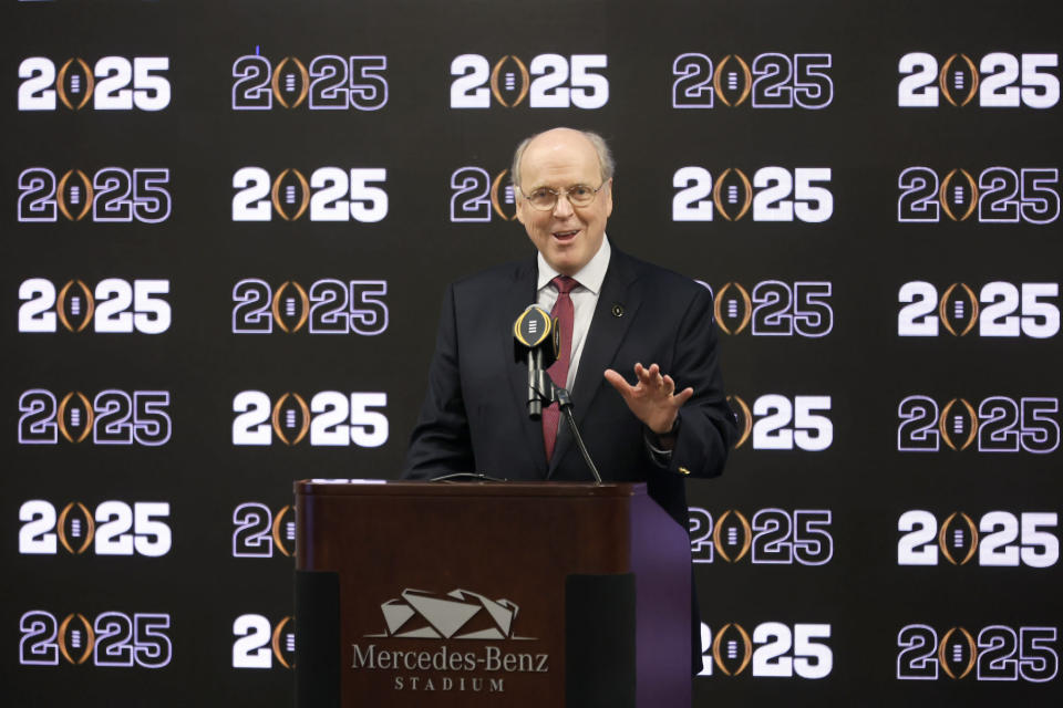 College Football Playoff executive director Bill Hancock speaks during a press conference at Mercedes-Benz Stadium, Tuesday, Aug. 16, 2022, in Atlanta, announcing that the CFP National Championship NCAA college football game will be played at Mercedes-Benz Stadium in 2025. (Jason Getz/Atlanta Journal-Constitution via AP)