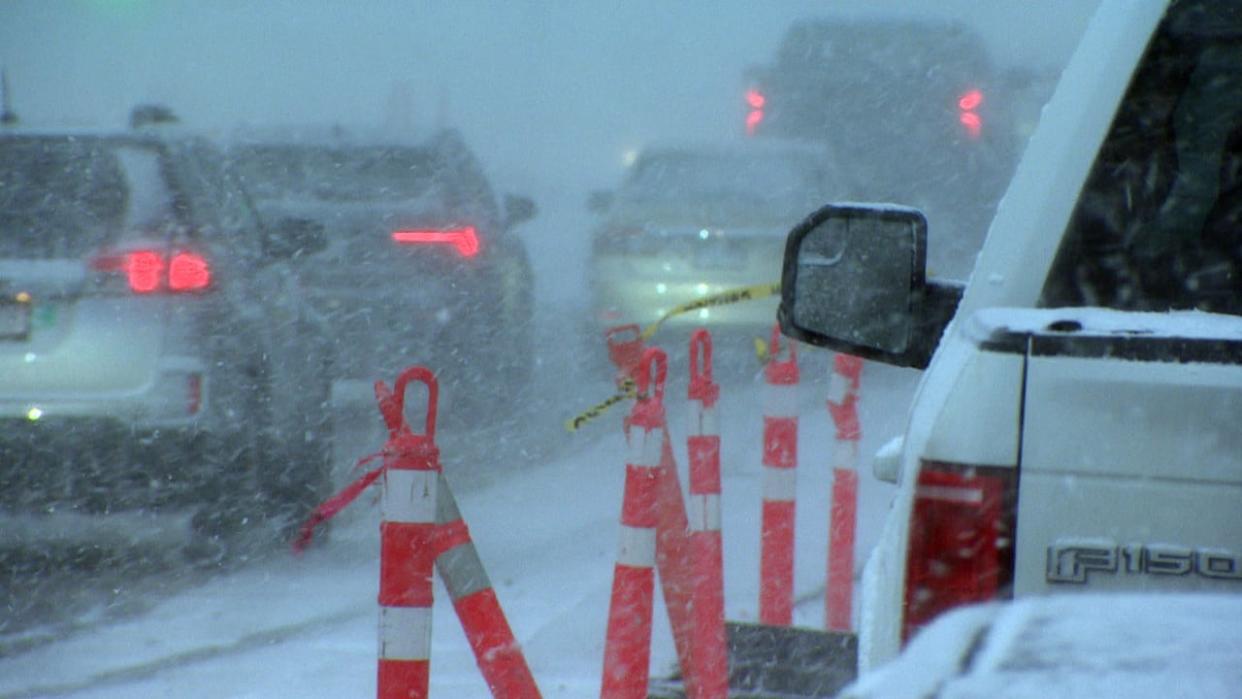 Sudden flurries slowed traffic near Gilmore SkyTrain Station in Burnaby, B.C., on Thursday afternoon. (CBC - image credit)