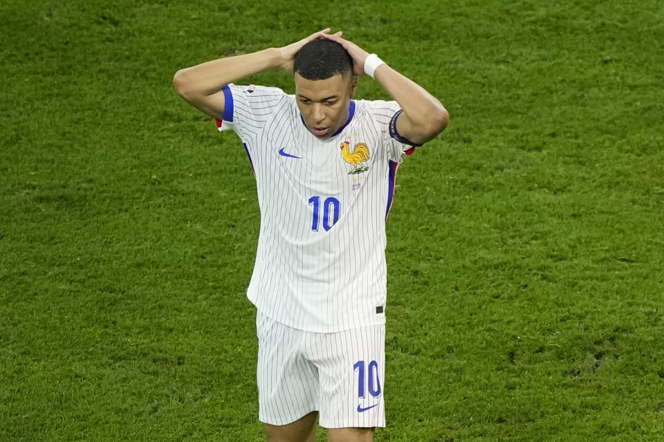 Kylian Mbappe of France reacts after missing a chance to score during a semifinal match between Spain and France at the Euro 2024 soccer tournament in Munich, Germany, Tuesday, July 9, 2024. (AP Photo/Ebrahim Noroozi)