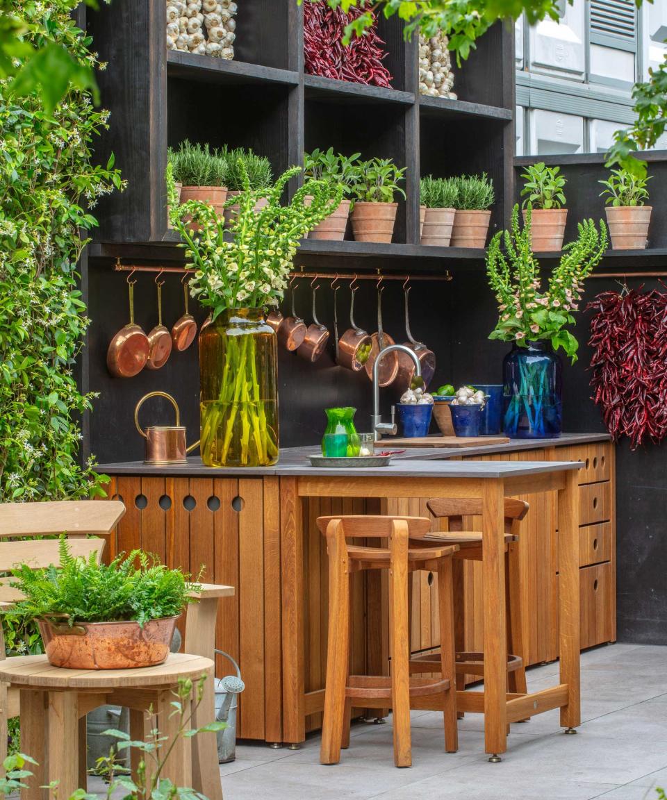 3. INCORPORATE POTTED HERBS INTO YOUR OUTDOOR KITCHEN