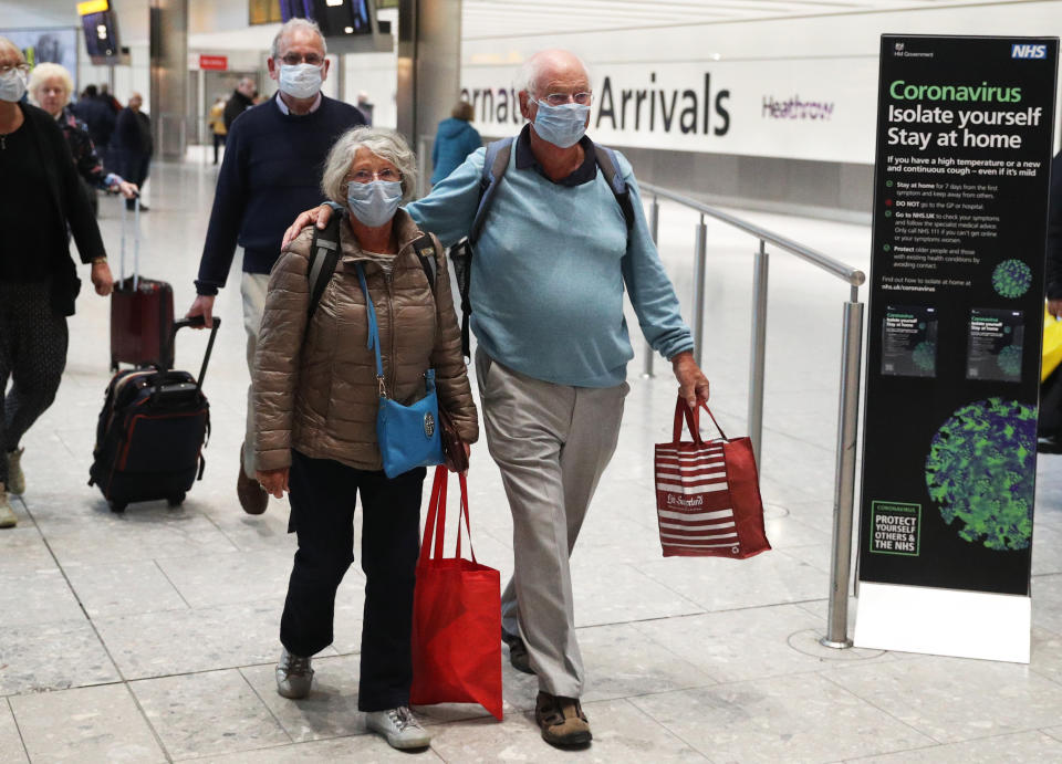 Passengers from the Covid-19-stricken Braemar cruise ship return to Heathrow Airport in London. (Photo by Steve Parsons/PA Images via Getty Images)