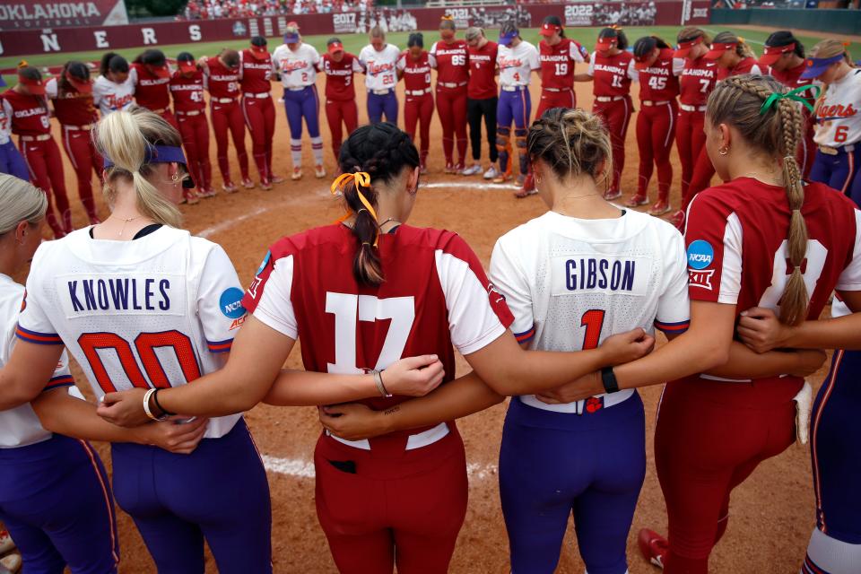 Oklahoma and Clemson gather at the pitcher's circle following the NCAA Norman Super Regional softball game between the University of Oklahoma Sooners and the Clemson Tigers at Marita Hynes Field in Norman, Okla., Saturday, May, 27, 2023. 