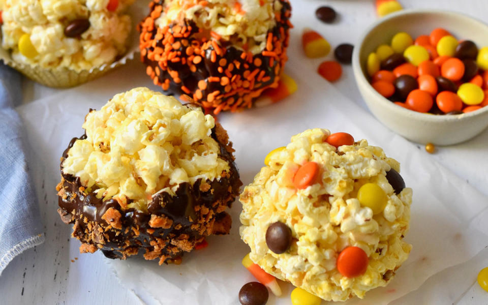 <p>Teresa Blackburn</p><p>Goblins young and old will love this retro recipe, made by tossing popcorn in a homemade syrup and mixing in your favorite Halloween candy. Use any sweet from your trick-or-treat haul, like Reese’s Pieces, crushed Butterfinger, sprinkles, or candy corn. </p><p><strong>Get the recipe: <a href="/1097329/parade/halloween-popcorn-balls-recipe/" data-ylk="slk:Festive Popcorn Balls;elm:context_link;itc:0;sec:content-canvas" class="link ">Festive Popcorn Balls</a></strong></p>