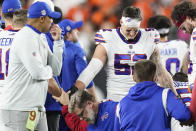 Buffalo Bills players and staff pray for Buffalo Bills' Damar Hamlin during the first half of an NFL football game against the Cincinnati Bengals, Monday, Jan. 2, 2023, in Cincinnati. The game has been indefinitely postponed after Buffalo Bills' Damar Hamlin collapsed, NFL Commissioner Roger Goodell announced. (AP Photo/Joshua A. Bickel)