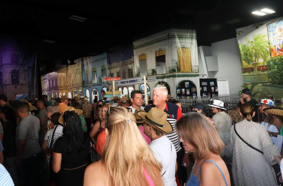Attendees of Cuba Nostalgia in 2022 gather next to the reproductions of buildings that highlight Havana architecture at the Miami fairgrounds. The Paseo del Prado, La Bodeguita del Medio, the Capitol, the Payret cinema are some of the places that are reproduced for the fair.
