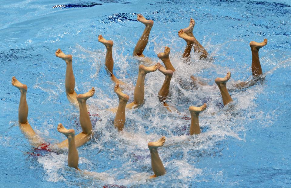 Members of the Chinese synchronize swimming team during an open training session at the Aquatics Center at Olympic Park ahead of competition in the London Olympic Games in London, Britain, 25 July 2012. EPA/DENNIS M. SABANGAN