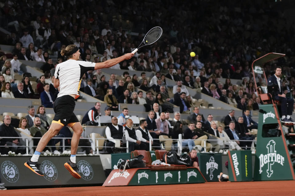 Germany's Alexander Zverev plays a shot against Denmark's Holger Rune during their fourth round match of the French Open tennis tournament at the Roland Garros stadium in Paris, Monday, June 3, 2024. (AP Photo/Thibault Camus)