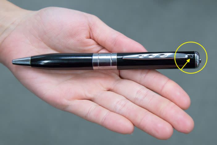 A spy pen with a small camera lens embedded 