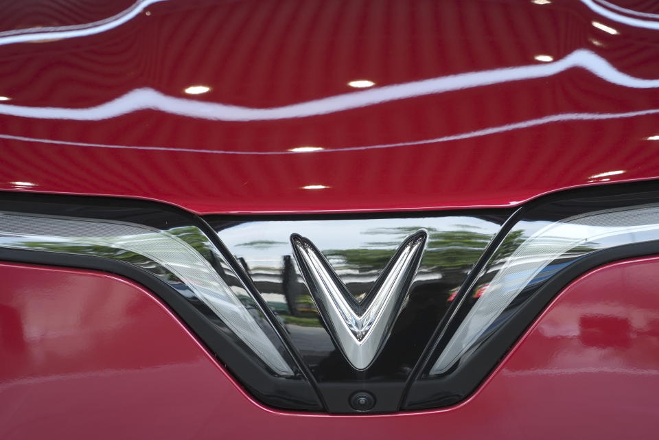 This photo shows the logo of a Vinfast electric car displayed in a showroom in Hanoi, Vietnam, June 10, 2024. Vietnamese automaker VinFast just can’t sell enough cars, so it's hoping its tiniest and cheapest car yet — a roughly 10-foot-long mini-SUV priced at $9,200 and called the VF3 — will become Vietnam's “national car" and win over consumers in Asian markets. (AP Photo/Hau Dinh)